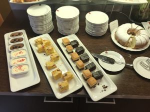 a table with plates of desserts