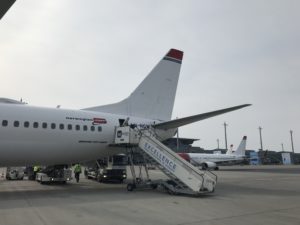 a plane with stairs going up to the tail