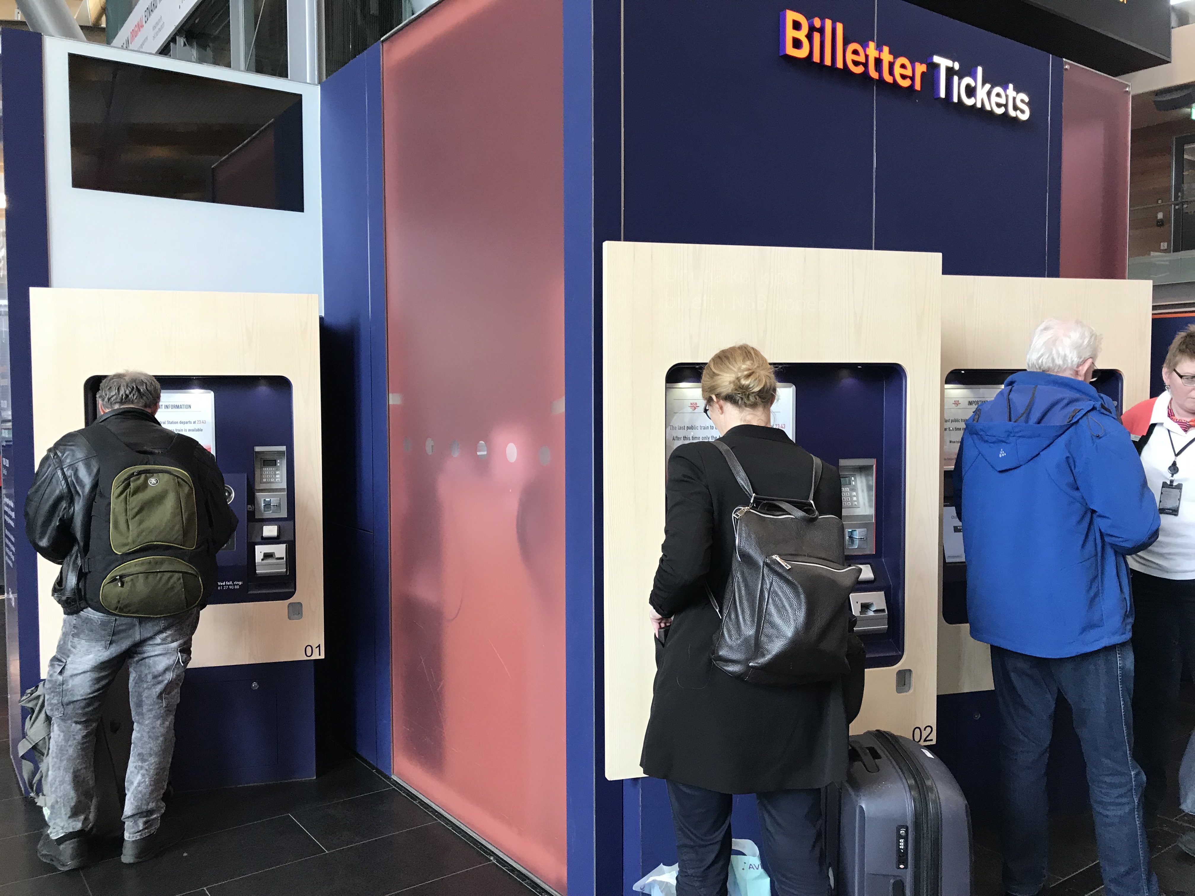 people standing in front of a machine