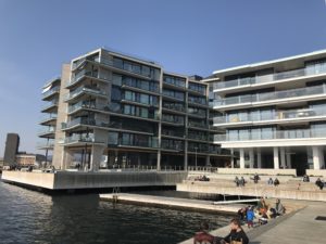 a building next to a body of water