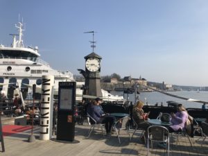 a clock tower on a dock