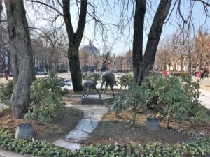 a statue of deer in a park