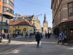 a group of people walking on a street