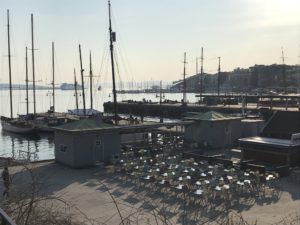 a dock with boats and buildings