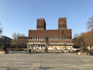 Oslo City Hall with a statue in front of it