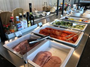 a buffet line with different types of food