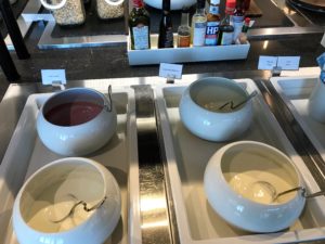 a group of bowls with sauces