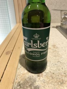 a green bottle on a counter