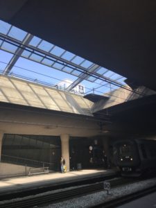 a train station with a roof
