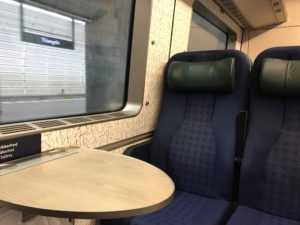 a table and chairs in a train