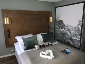 a bed with pillows and a heart on it