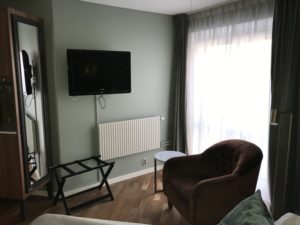 a room with a television on the wall
