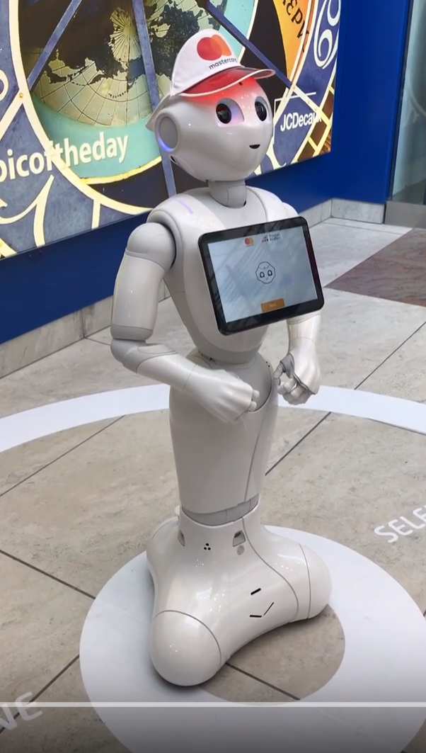 a robot standing on a tile floor