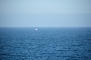 a boat in the middle of the ocean