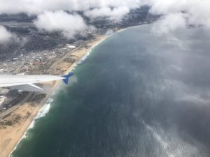 an airplane wing above the water