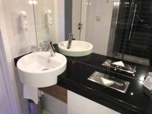 a sink and mirror in a bathroom