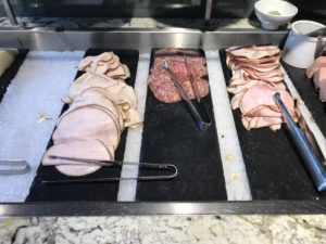 a tray of meat and ham