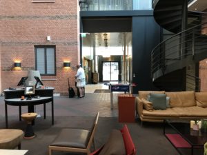 a room with a spiral staircase and a couch