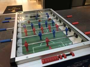 a foosball table with red and blue players