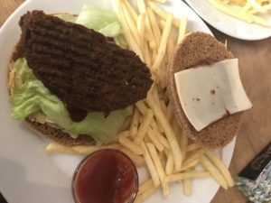 a plate of food with a burger and fries