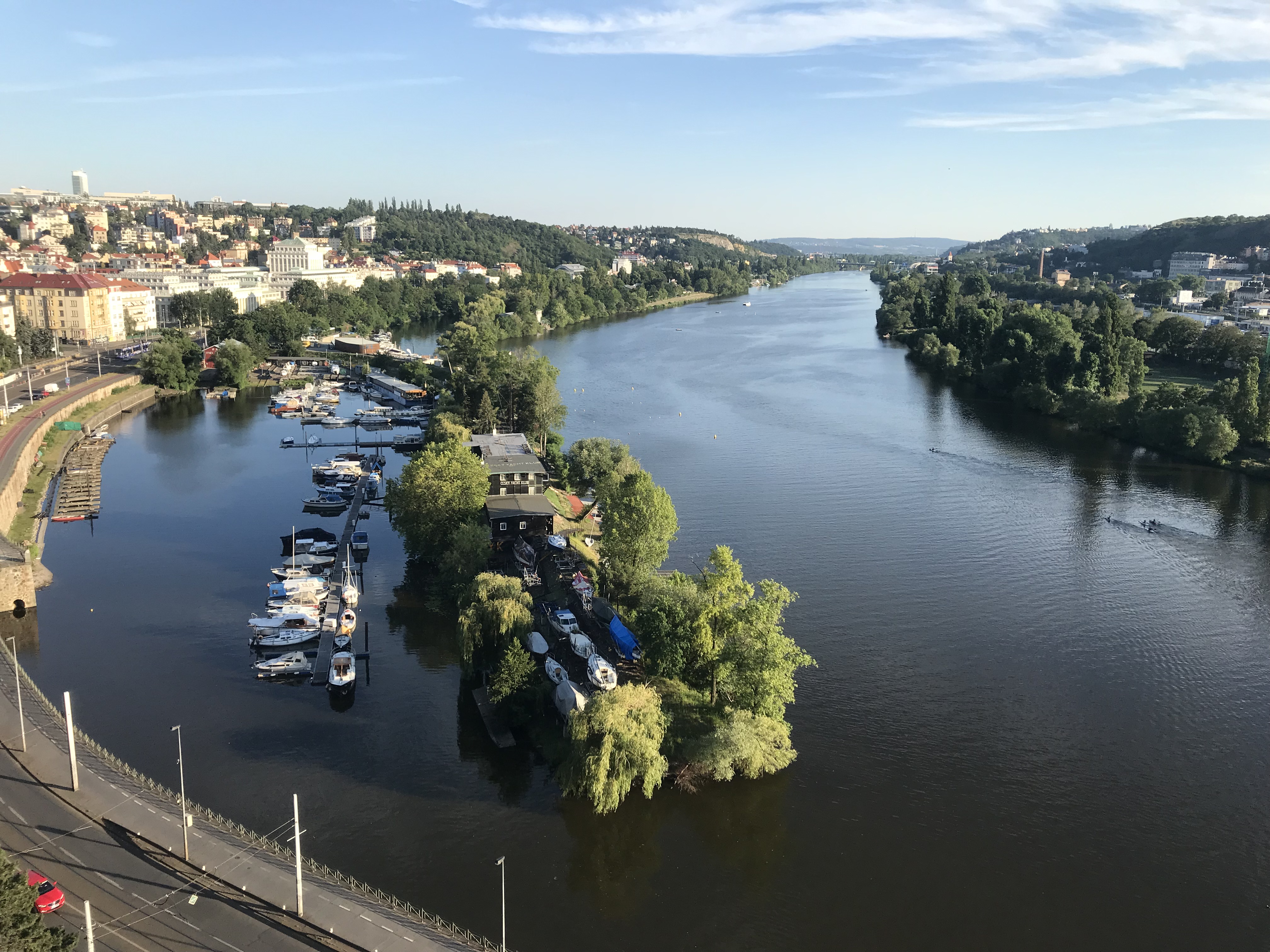 a river with boats and trees