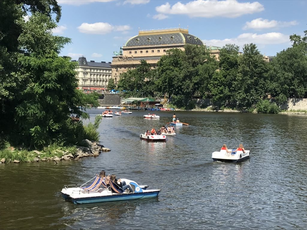 a group of people in boats on a lake