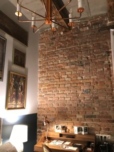 a brick wall with a chandelier