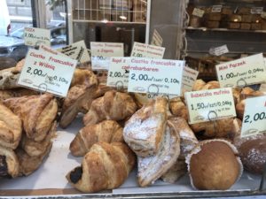 a display of pastries with price tags