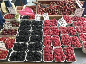 a group of containers of berries