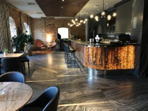 a bar with chairs and a table