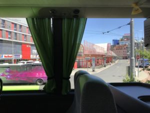 a view of a city from a bus window
