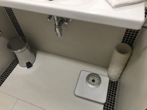 a bathroom sink with a weight scale
