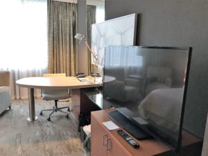 a room with a television and a table