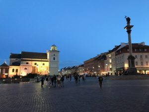 a group of people walking in a city