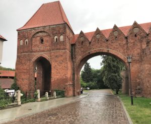 a brick building with a brick archway