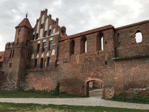 a brick building with a gate