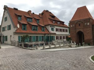 a brick building with a gate