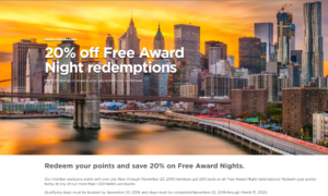 a bridge over a river with a city in the background