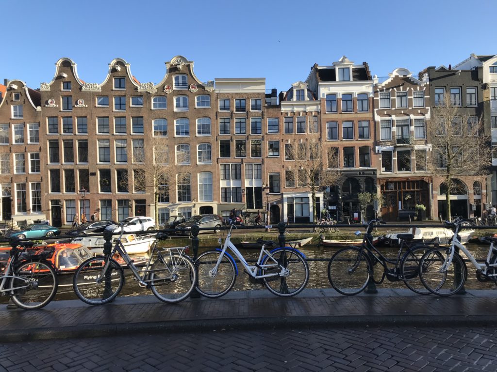 bicycles on a rail by a canal