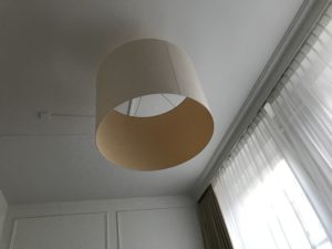a light fixture from the ceiling