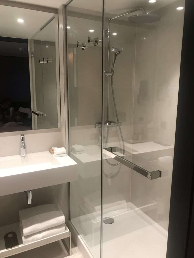 a shower and sink in a bathroom