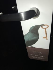 a door handle with a bird and key