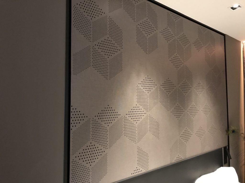 a white and black wall with a square pattern on it