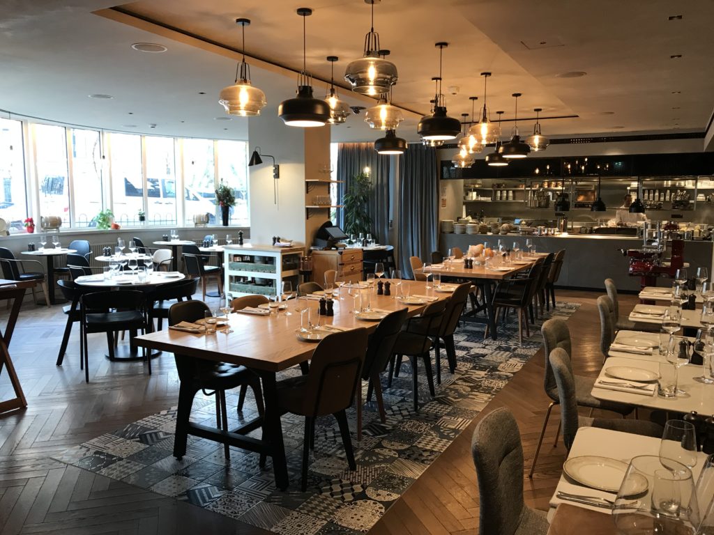 a large room with tables and chairs