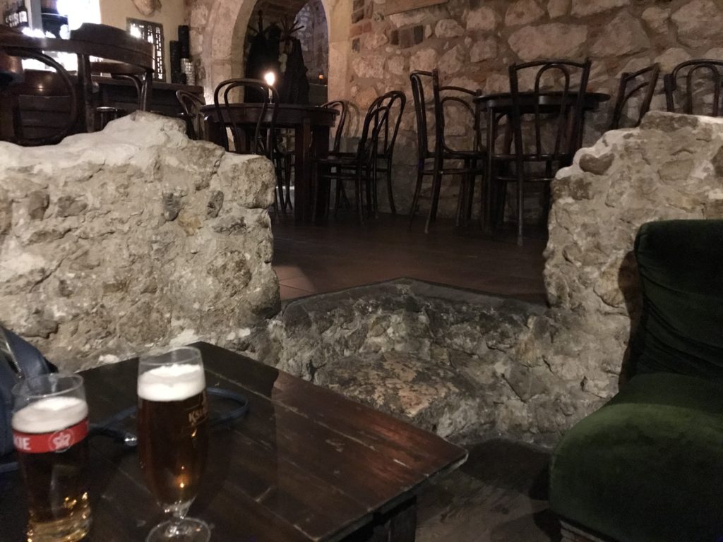 a table with a glass of beer on it
