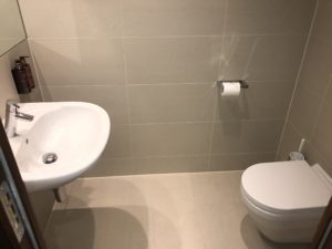 a toilet and sink in a bathroom