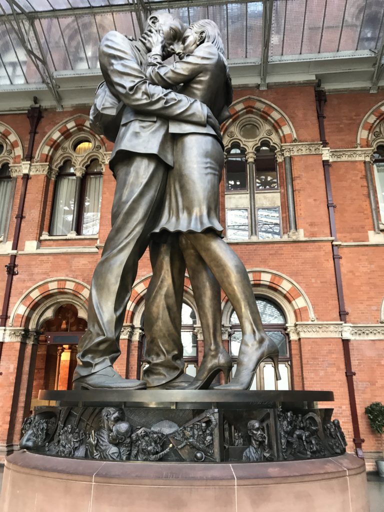 a statue of a man and woman hugging