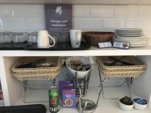 a shelf with dishes and cups