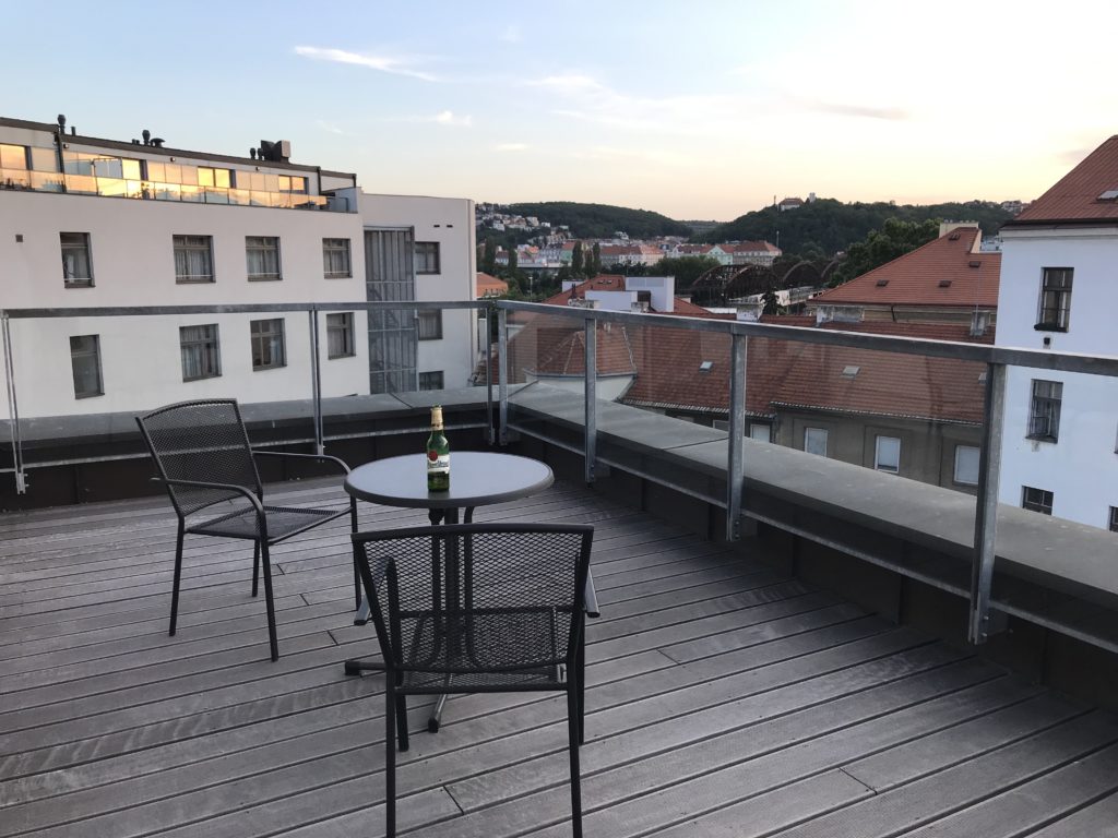 a table and chairs on a deck