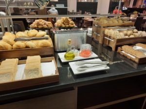 a counter with different types of bread